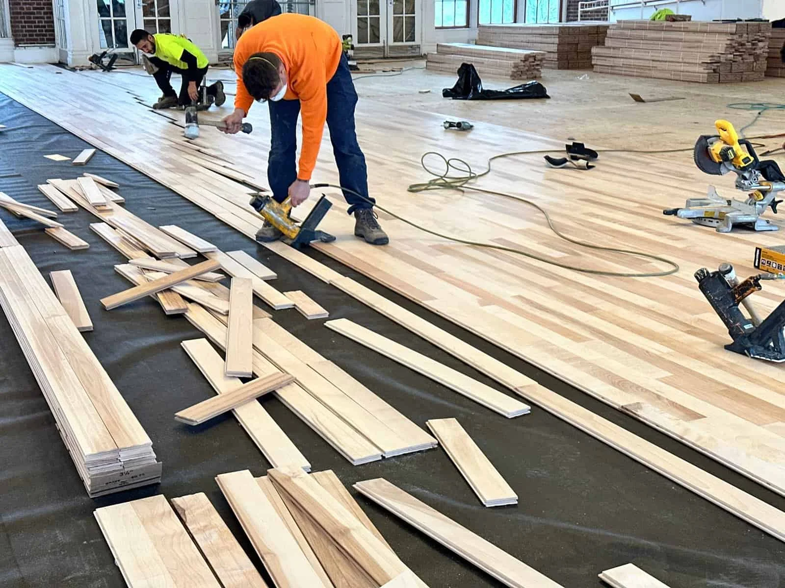 Florico crew installing hardwood flooring